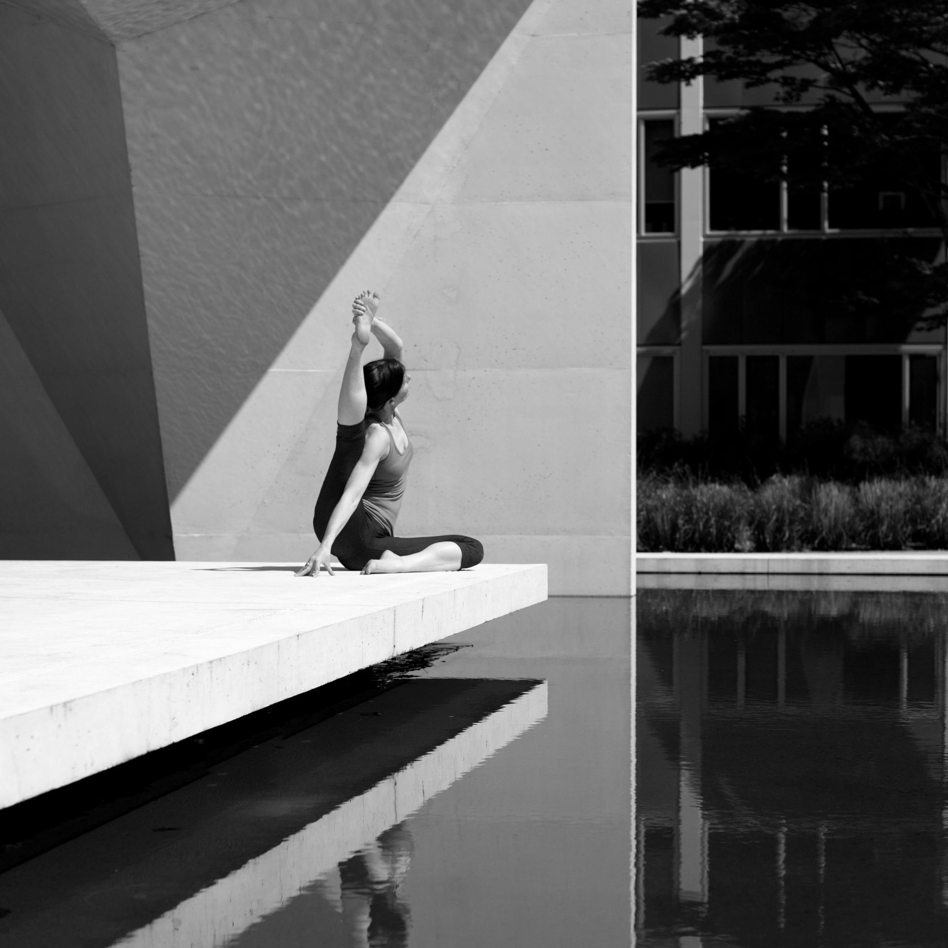 Grayscale Photo of Woman in Yoga