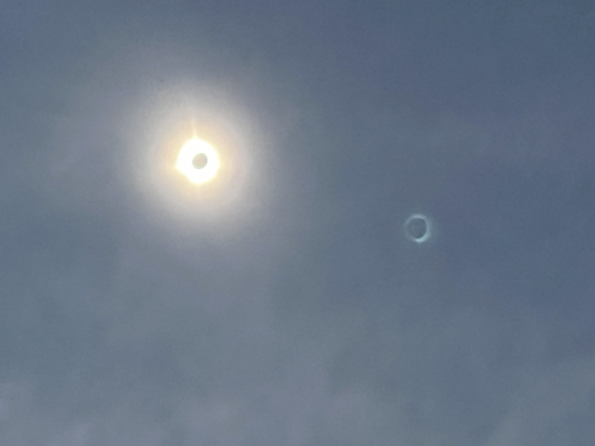 Picture taken with my phone during total eclipse. On the right is Jupiter