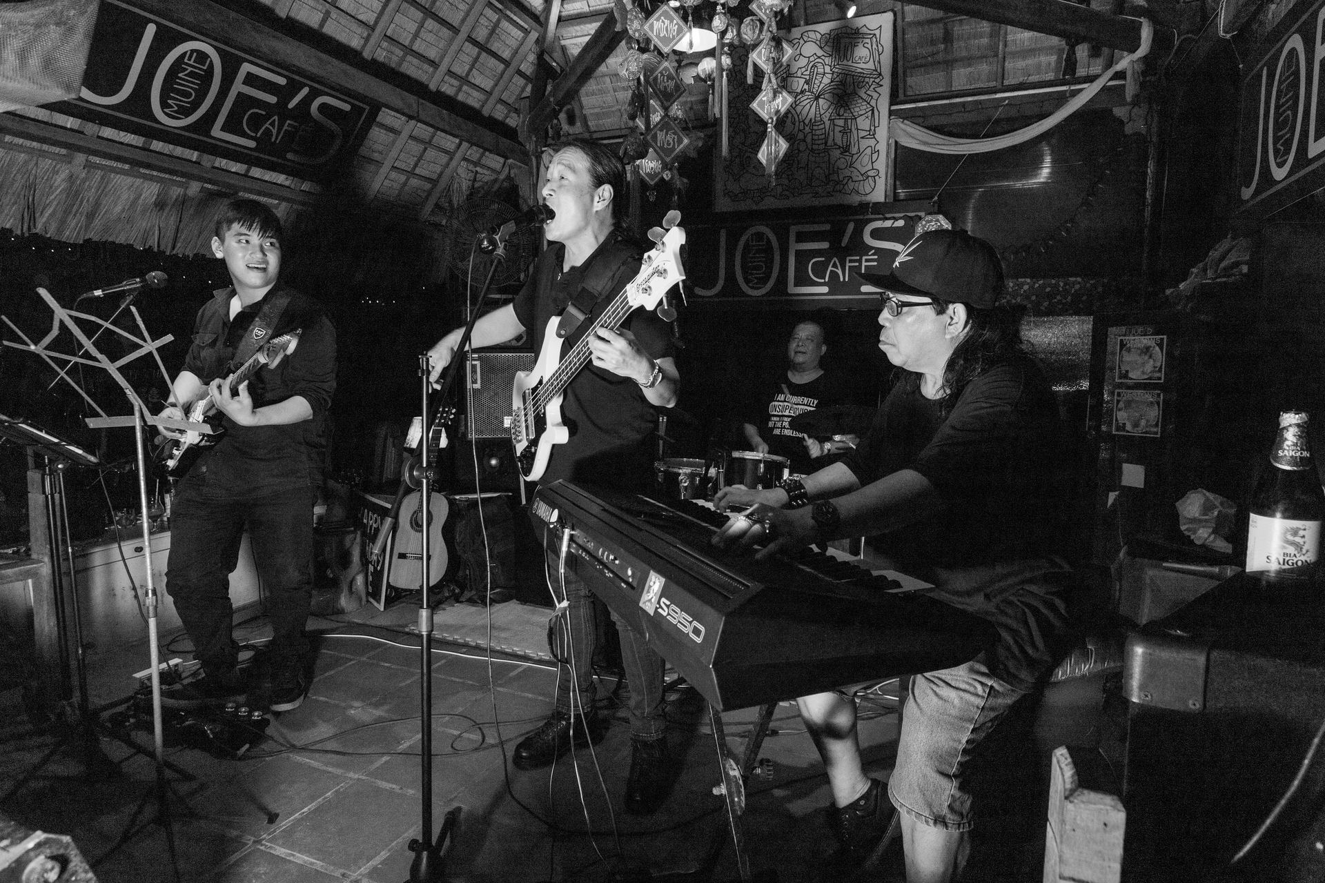 Image may contain person, on stage, playing a musical instrument and indoor